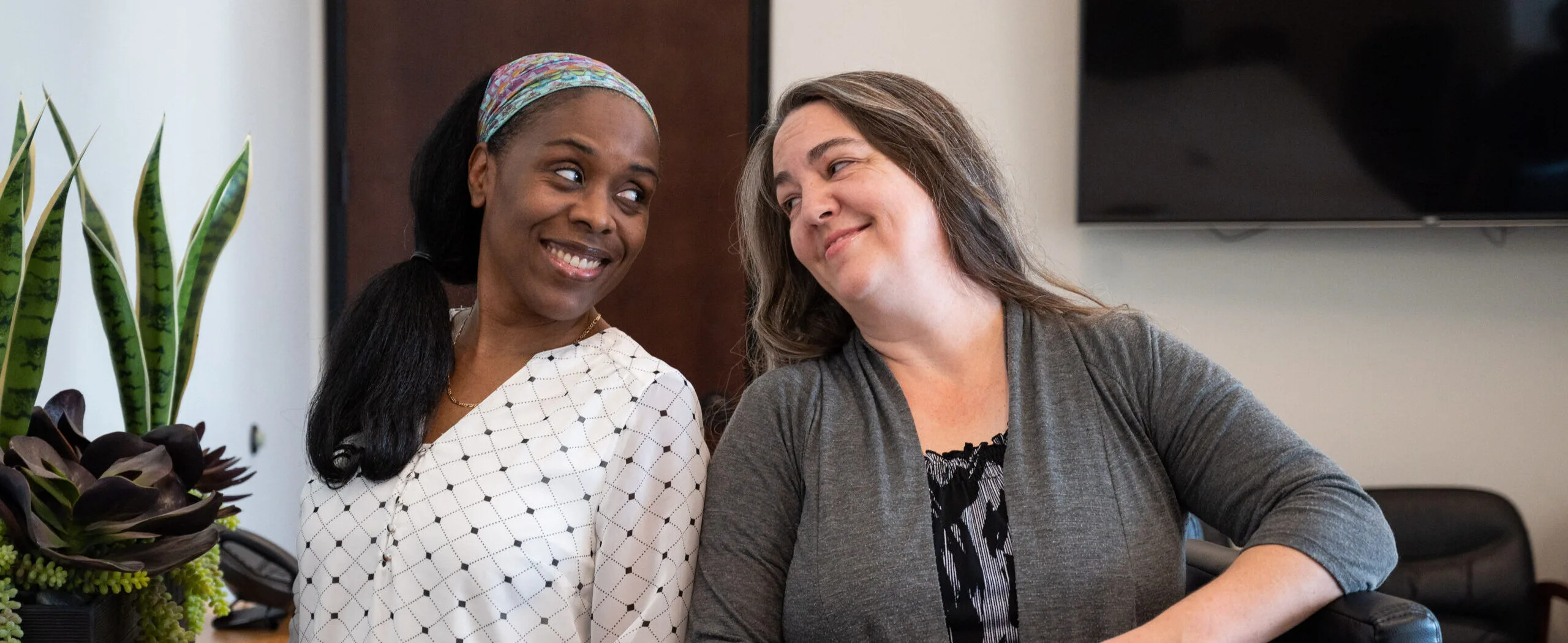 Business consulting team members sharing a friendly moment in the office